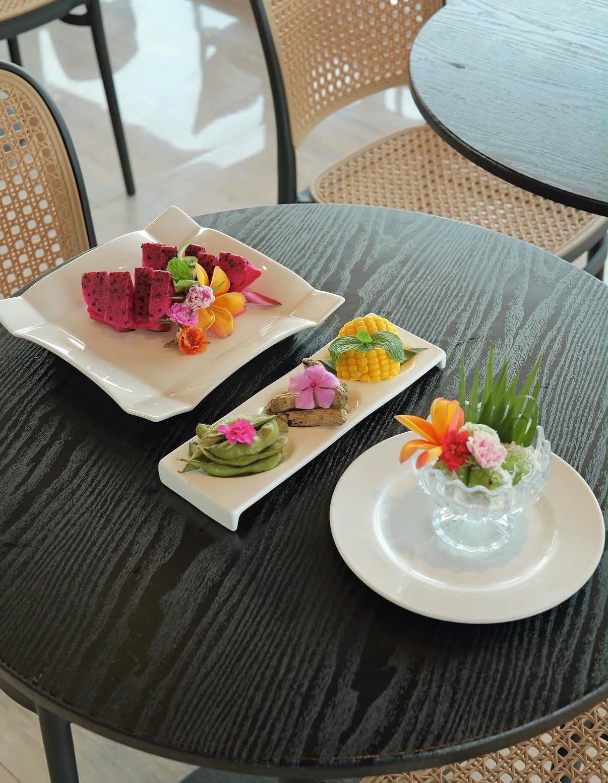 Tropical breakfast plate with coffee at Boss Legian Hotel
